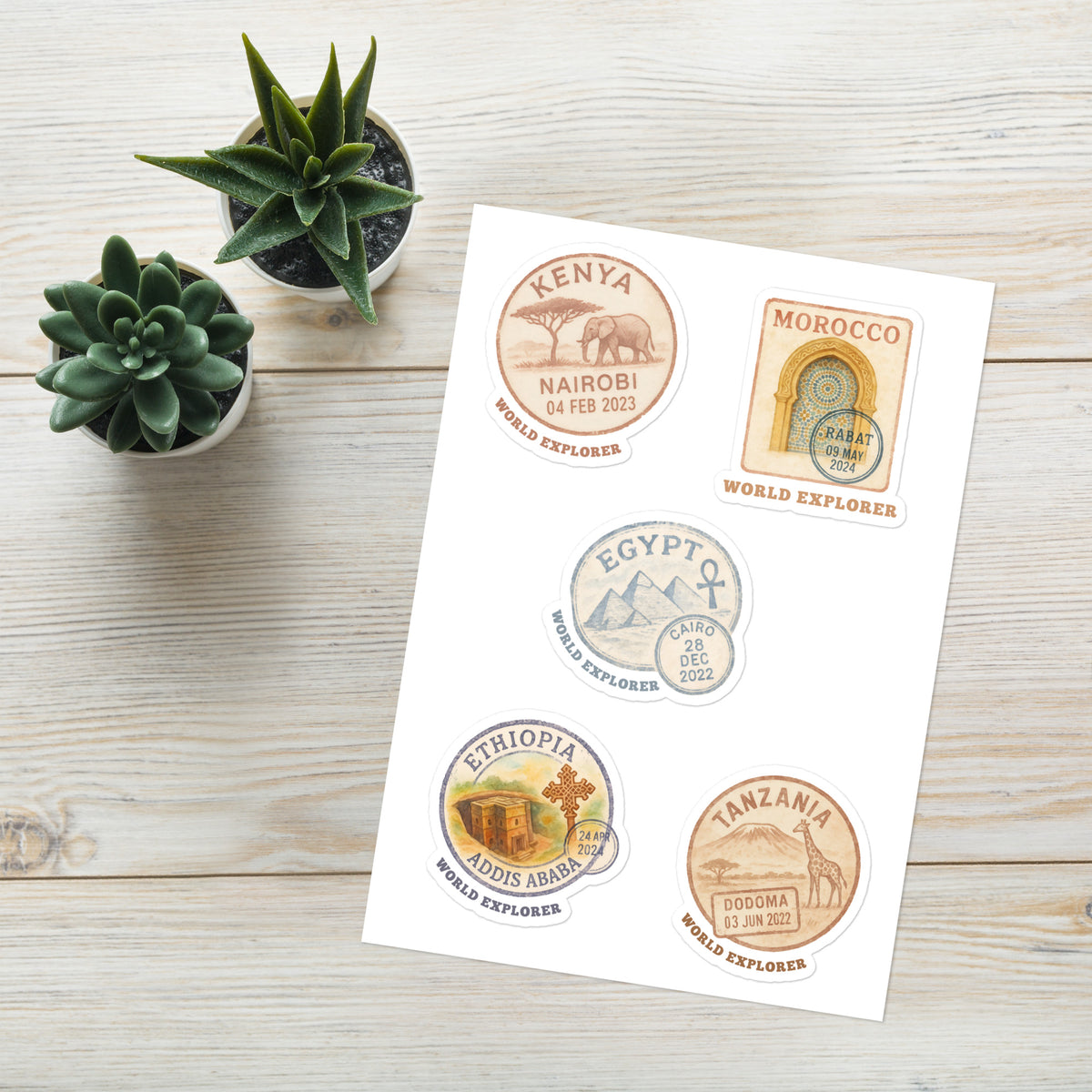 Wanderer sticker sheet with five passport stamp designs for Kenya, Morocco, Egypt, Ethiopia and Tanzania, featuring wildlife, architecture and pyramids.