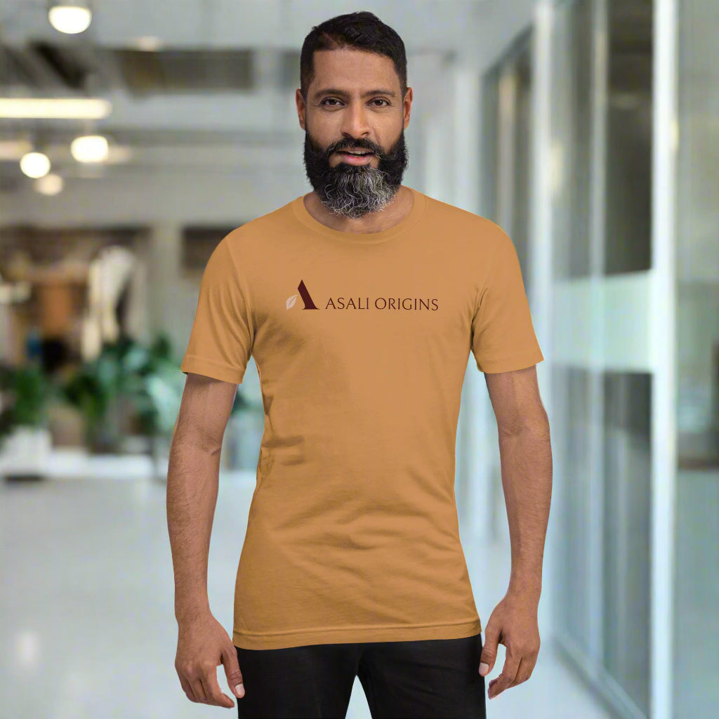 Man wearing a mustard yellow t-shirt with 'Asali Origins' logo on a white background