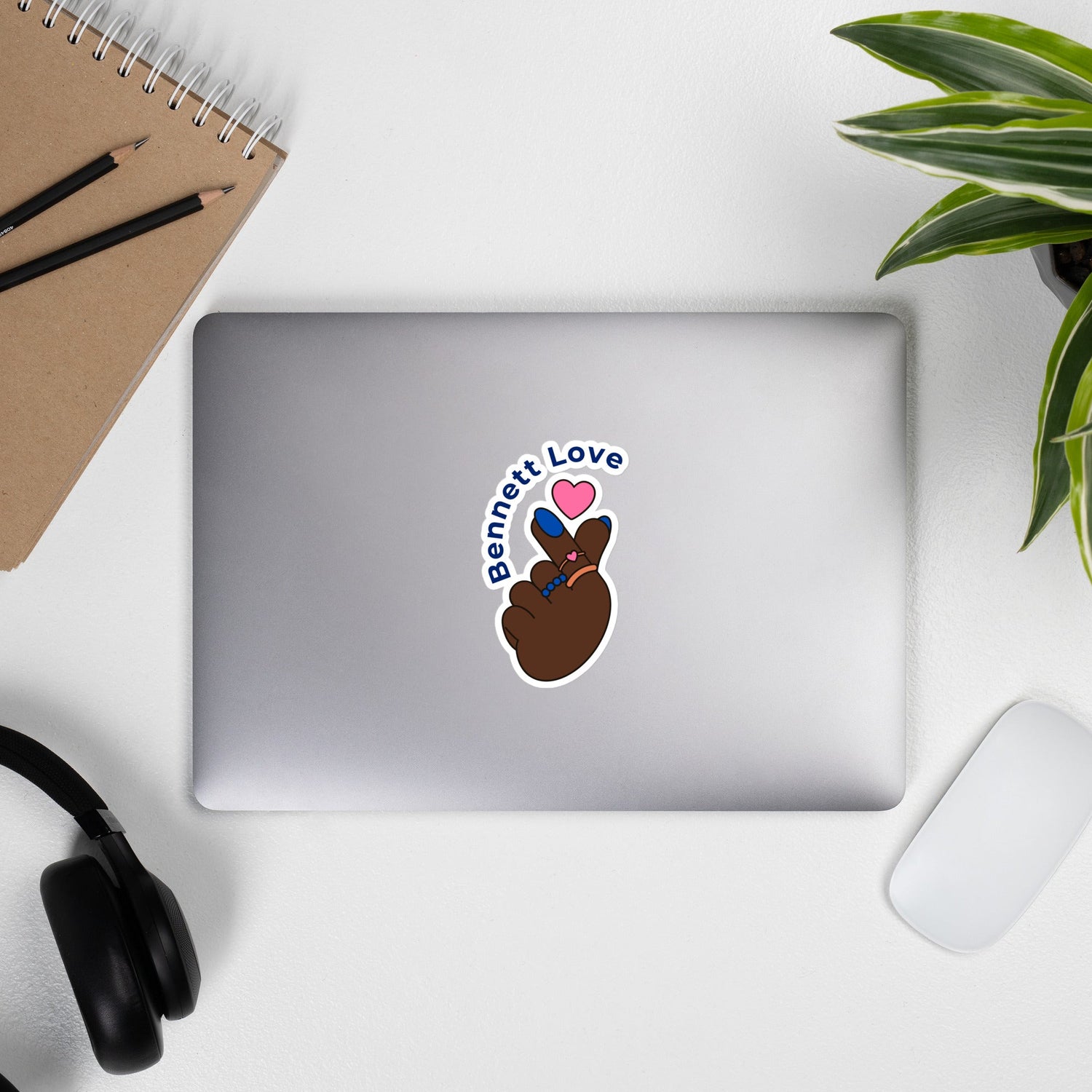 Bennett College heart fingers sticker on laptop