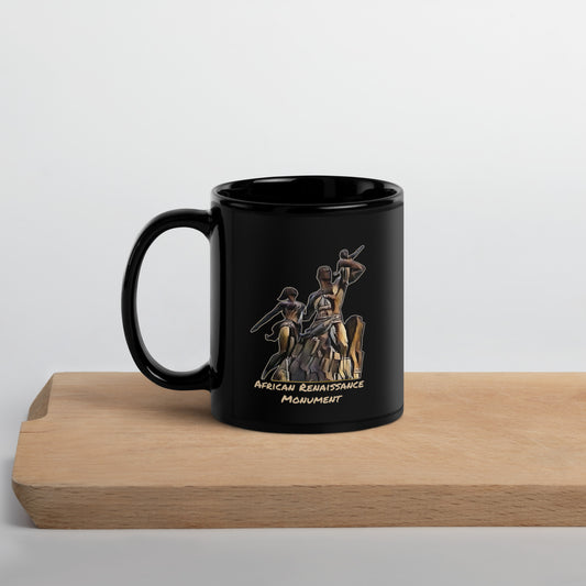 Black mug with 'African Renaissance Monument' design on a wooden surface