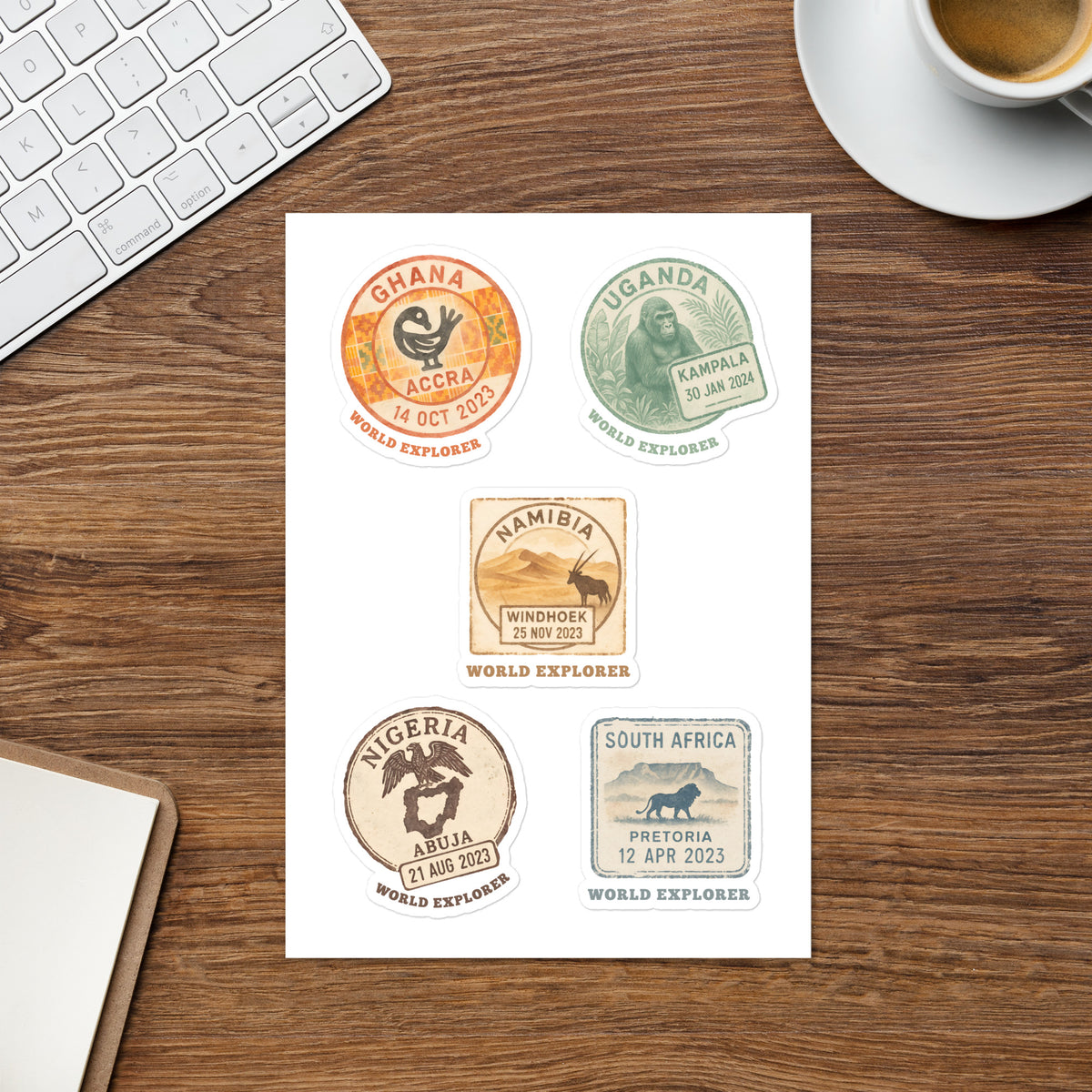 Explorer sticker sheet with five colorful passport stamp designs for Ghana, Uganda, Namibia, Nigeria and South Africa, each with World Explorer lettering.
