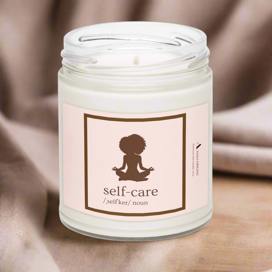 Candle in a jar with a 'self-care' label on a neutral background
