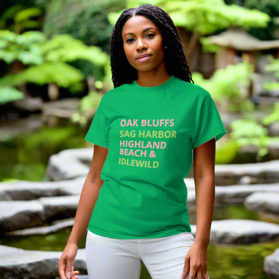 Person wearing a green t-shirt with text standing in a natural setting