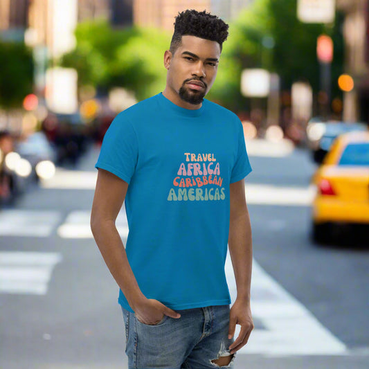 Man wearing a blue t-shirt with colorful text in the city