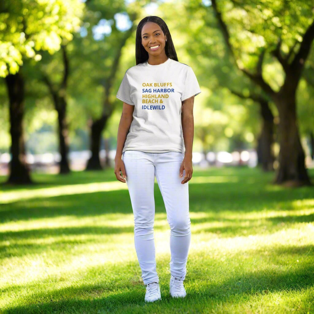 Person wearing a white t-shirt with text standing in a park
