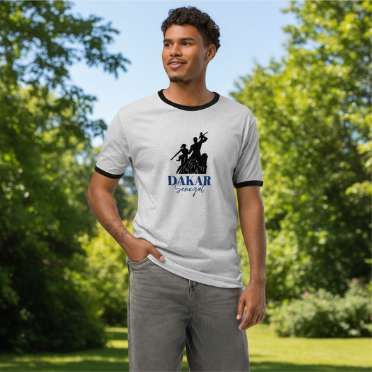 Man wearing a gray and black ringer shirt with 'Dakar Senegal' design outdoors.