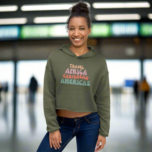 woman wearing a green hoodie at a train station