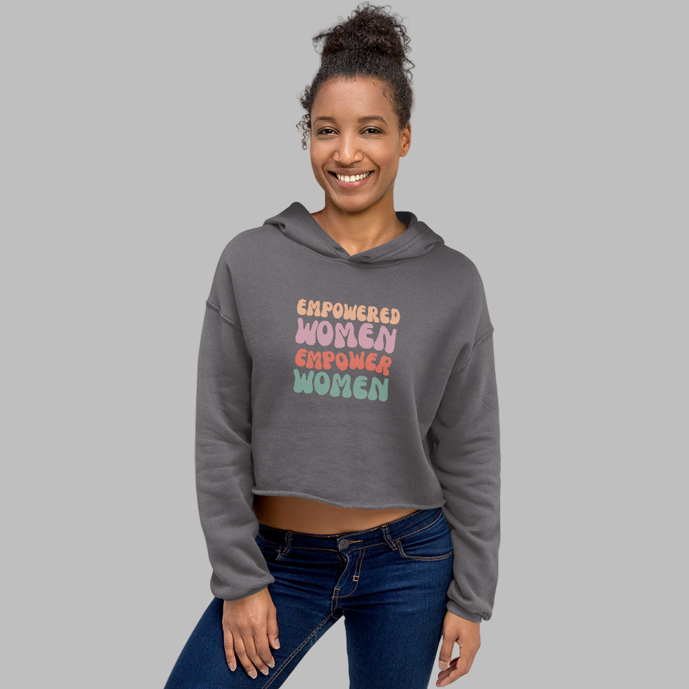 Woman wearing a gray hoodie with 'Empowered Women Empower Women' text on a white background
