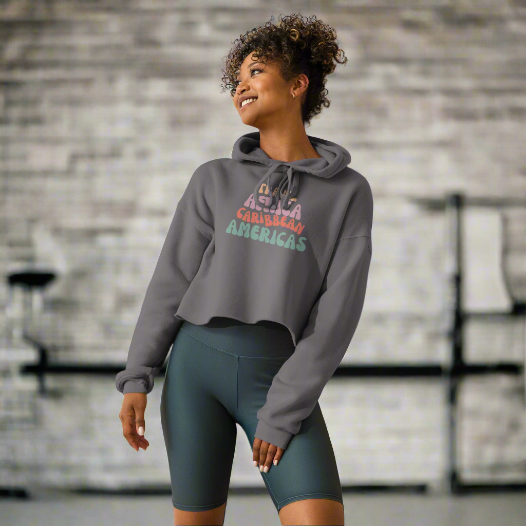 woman wearing a gray cropped hoodie at a gym